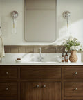 Bathroom with Brushed Nickel Vanity Faucet With 4 Inch Centerset Or Single Hole Setup, Swivel Spout, and wooden vanity