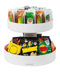 Smooth Rotating Two Tier Snack Carousel Countertop Organizer with snacks, white resin, perfect for kitchen or breakroom.