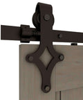 Close-up of 7 Ft Sliding Barn Door Hardware Kit With Floor Guide, Heavy Duty Modern Style, Frosted Black Steel Track showing hanger detail