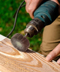 Close-up of Twenty Piece Pro Grade Abrasive Flap Wheel Sander Set With Eight Flap Wheel Sizes And Two Cone Shapes, 80 Grit in use on wood.
