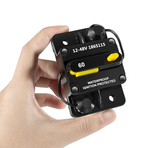Hand holding 60 Amp Waterproof Circuit Breaker For All 12V To 48V Electric Trolling Motors MKR-27 Replacement Part Marine Grade