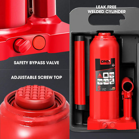 Close-up of a red heavy duty 6 ton hydraulic bottle jack for cars, trucks and SUVs with welded steel construction and manual handle.