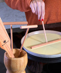 Crepe Spreader Set With Turner Four Piece Wooden Batter Tools 3.5 Inch 5 Inch 7 Inch 12 Inch T Shaped Design in use on a pan