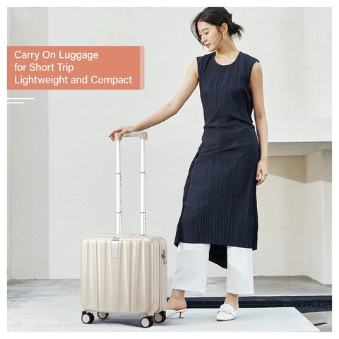 Woman with ivory white underseat carry-on luggage 16 inch hard shell weekender suitcase, lightweight with wheels, fits under airline seats.