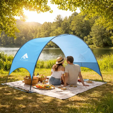 Couple under UPF 50 Plus Beach Tent Canopy With 360 Degree Ventilation Portable Sun Shade For The Fam at lakeside picnic on sunny day