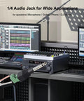 Heavy Duty No Sweat Solderless Quarter Inch Mono Audio Jacks Four Pack connected to audio equipment in a studio setting.