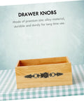 European Carving Handle 8.46 Inch Antique Bronze Cabinet Pulls Zinc Alloy on a wooden drawer box against a patterned background