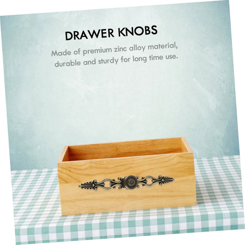 European Carving Handle 8.46 Inch Antique Bronze Cabinet Pulls Zinc Alloy on a wooden drawer box against a patterned background