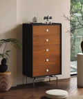 A wooden dresser with white knobs in a room with ceramic decor, showcasing 8 Piece Antique Bronze Ceramic Dresser Handles Set For Cabinets And Drawers.