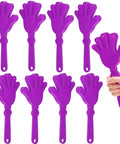 Eight Piece Hand Clappers 7.5 Inch Clapping Noisemakers Plastic Noise Makers in purple, with one held in a hand.