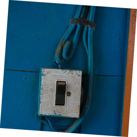 Wall-mounted electrical switch with blue wires secured by Heavy Duty Adjustable Zip Ties For Indoor And Outdoor Use Reusable Cable Management Straps With Quick Release Buckle