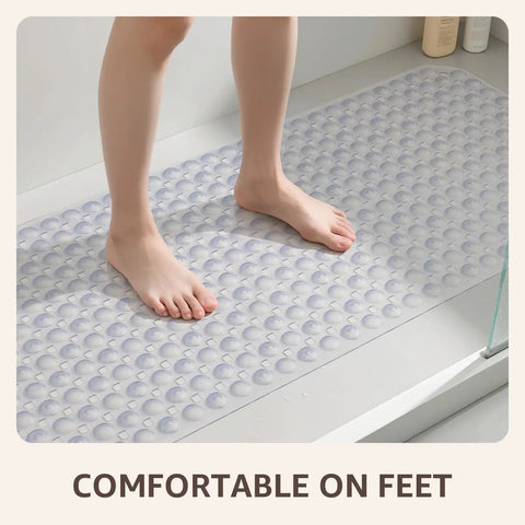 Big Time Grip Non Slip Bathtub Shower Mat Features Heavy Duty Suction Cups For Zero Slip Drains Quick Dry Cutouts Made From Soft Bendable Tpe For Super Chill Foot Comfort And Hassle Free Rinse Clear Thirty Five By Sixteen Inch Layout with feet standing on it