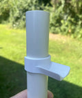 Close-up of One Inch Jump Cups For Dog Agility Equipment Set Of Ten That Snap-On To Factory Labeled One Inch PVC Pipe outdoors.