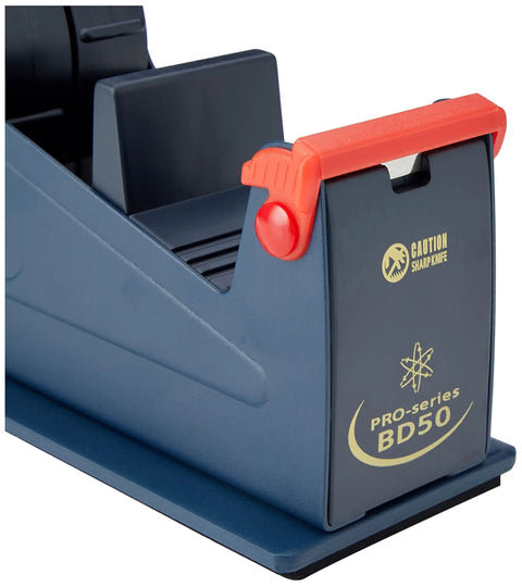 The Real Deal Heavy Steel Desktop Tape Dispenser Handles Up To Two Inch Packing Rolls With Three Inch Core And Delivers Smooth One Handed Cutting Plus Super Grippy Non Slip Workstation Base, detail of sharp knife caution.