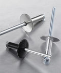 Dead Set Heavy Duty Black Aluminum Pop Rivets 3/16 X 1/2 Inch Large Cap showing various colors and styles on gray background.