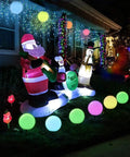 Outdoor display with 8 Inch LED Night Light Ball With Remote, 16 RGB Colors, floating pool lights among holiday decorations.