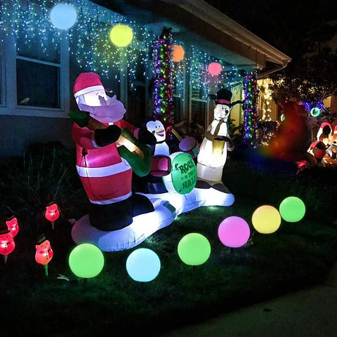 Outdoor display with 8 Inch LED Night Light Ball With Remote, 16 RGB Colors, floating pool lights among holiday decorations.