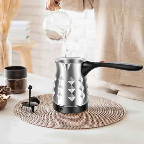 Turkish Coffee Maker 500ml Stainless Steel Pot With Folding Handle 5 To 6 Cup Capacity Electric Warmer Kettle For Home Or Travel Diamond Finish Go To Brew on a table