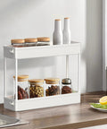 Slim 4 Tier Storage Cart With Rolling Wheels And Narrow Profile for kitchen spices on countertop; white compact storage; ideal for tight gaps.