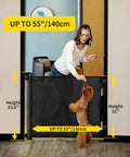 Woman using Retractable Mesh Baby Gate For Doorways, Stairs, And Hallways, 33 Inch Tall, Expands Up To 55 Inches Wide with dog