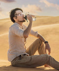 Man wearing Bulk 100 Pack Safety Glasses Eye Protection Eyewear Clear Lenses in a desert setting