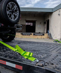 Heavy Duty Axle Tie Down Kit Featuring Hella Bright Neon Green 2 Inch Webbing And Reliable Wire J Hook Ratchet Straps for secure hauling.