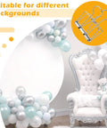8 Pack Heavy Duty Balloon Arch Clips Set with large metal clamp, backdrop of silver and blue balloons, and elegant white chair.