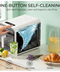 Slick Portable Countertop Ice Maker With Square Cube Batches And Smart Infrared Tracking For Fresh On Demand Chill Plus No Sweat Pullout Drawer And Auto Shut Off For Fast Weekender Prep, showing self-cleaning feature and fresh ice.