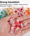 Hand holding connectors from Must Have Waterproof Gel Filled Wire Connector Kit 151 Piece All In One For Network And Phone Cables