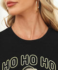 Close-up of Women Santa Graphic Tee With Black Hat And Sunglasses, short sleeve crewneck, showing festive graphic and soft material