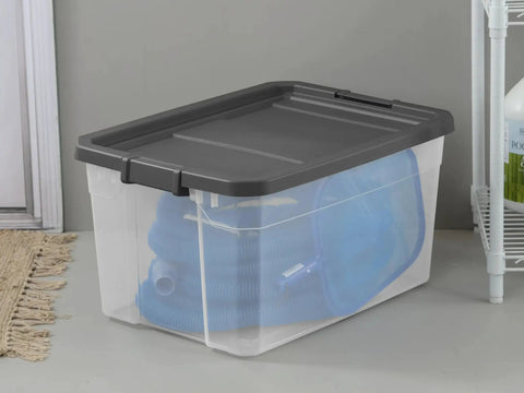 2 Pack 76 Quart Clear Stackable Storage Bins With No Fuss Latch Lids And Dark Gray Covers holding blue hoses, ideal for home organization.