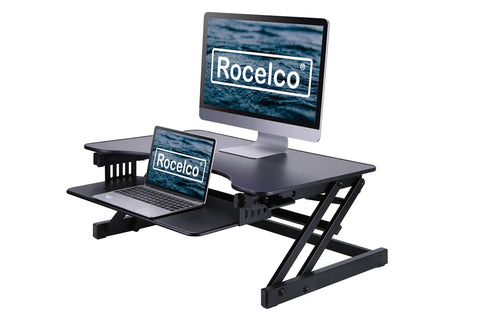 32 Inch Height Adjustable Standing Desk Converter With Slide Out Keyboard Tray and Dual Monitor Riser in black, featuring laptops on riser.