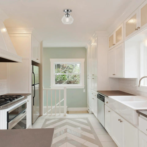 Harrow 1-Light Semi-Flush Mount Ceiling Light In Chrome With Clear Glass Shade in a modern white kitchen.