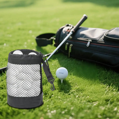 Black Golf Ball Storage Bag Portable Drawstring Pouch near golf course with clubs and golf ball, durable polyester nylon mesh.