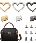 Three heart-shaped purse turn locks in gold, silver, and gunmetal with screws; shown installed on a black handbag.
