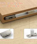 Close-up of 32 Inch Concealed Sliding Barn Door Hardware Kit with Two Soft Close Mechanisms showing bottom wheel and floor guide