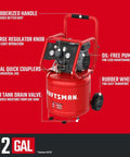 Heavy Duty 12 Gallon Air Compressor Powers Up Silky Quiet With An Oil Free Build And Rugged 1.5 HP Engine showing features like rubberized handle and dual quick couplers.
