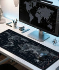 World Map XXL Mouse Pad 35.4 By 15.7 Inch with non-slip rubber base on white desk, showing detailed map design, used for gaming setup.