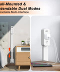 Flexible Outlet Extender Stick With Usb A And C Fast Charge Plus Two Ac Receptacles Stretches 22 To 34 Inches Swivels 180 Degrees Nips The Pinch Behind Couches And Desks on a wall beside furniture.