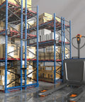 Heavy Duty Electric Pallet Jack Truck 4400 Lbs Capacity 48V Lithium Battery Indoor Cargo Handler beside stacked shelves.