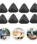 Close-up of black corner protectors on tables, from 100Pcs Black Plastic Corner Protectors For Boxes And Desks collection.