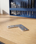 Heavy Duty Stainless Steel L Bracket Corner Brace 1.6x1.6 Inch Right Angle Support Connector on a wooden surface