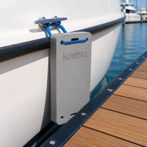 Yacht Dock Edge Protector EVA Cushion 18x42x4 cm with tying rope attached to boat at dockside.