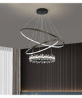 Modern Nordic Pendant Light With Dimmable LED Remote And Layered Acrylic Diffuser Perfect For Kitchen Bedroom Living Room Or Dining Space hanging in a stylish room, showcasing three rings and crystal accents.