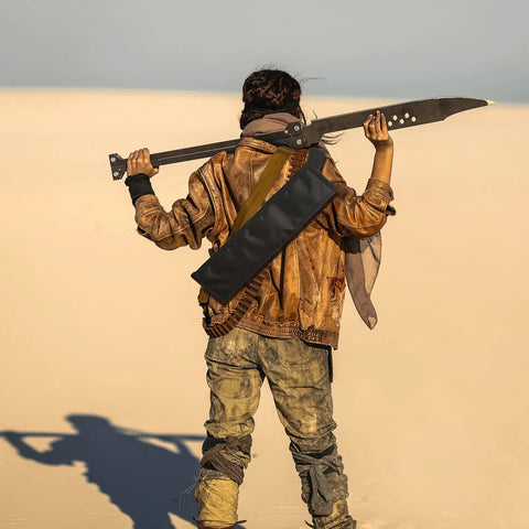 Person in desert holding sword with Two Piece Black Katana Sword Bag Kit With Back Strap And Waistband, cosplay costume, nylon holder.