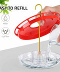 Two Pack 16 Oz Hummingbird Feeders Dish Style Leak Proof With Built In Ant Moat And Bee Proof Feeding Ports being refilled
