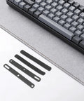 Four Piece Top Tier Keyboard Soundproof Foam Silencer For Space Bar Heavy Duty Acoustic Sponge Pads on a gray desk mat.