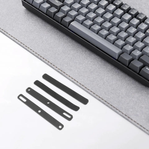 Four Piece Top Tier Keyboard Soundproof Foam Silencer For Space Bar Heavy Duty Acoustic Sponge Pads on a gray desk mat.