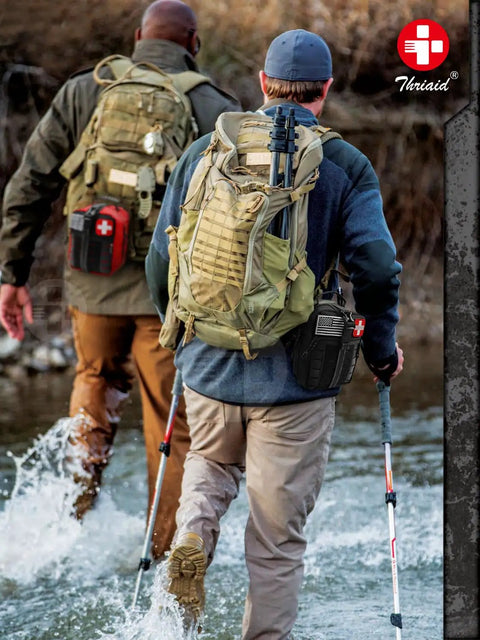 Men hiking with backpacks carrying Essential Trauma First Aid Kit With Israeli Bandage Chest Seal Tourniquet Splint And Molle IFAK