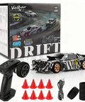 Mini 1/43 Scale Drift RC Car With Gyro And 2.4GHz Proportional Remote, includes cones, tires, and camouflage finish displayed